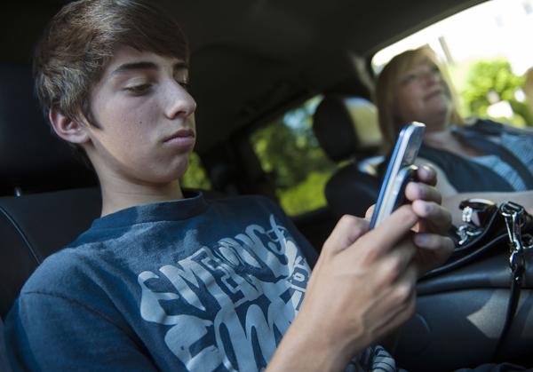Brandon Gonzales, 12, has been using a cell phone since he was 10. Almost all of his friends have cell phones, too. His mom, Elizabeth Gonzales, likes knowing that he can call home at any time. It gives me peace of mind, she said. Kids ages 9 to 12 are the fastest-growing cell phone market. (Renee C. Byer/Sacramento Bee/MCT)
