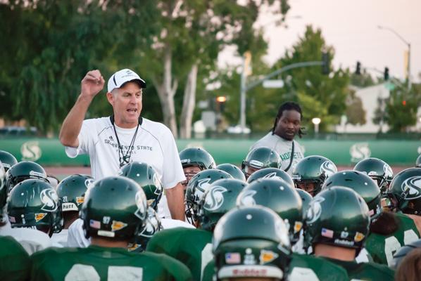 Sacramento State head football coach Marshall Sperbeck gives the team a pep talk during practice on Wednesday. Coming off another upset victory over a Pac-12 Conference team, the Hornets will host the University of Northern Colorado in their home opener on Saturday.
