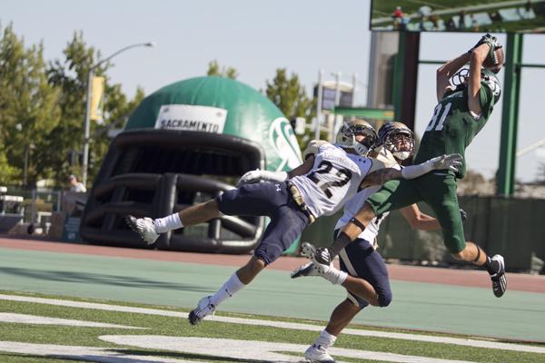 Northern Colorado sophomore defensive back Mykel Morse attempts to block a pass to Hornet freshman wide receiver Blake Robertson in Hornet Stadium on Saturday.
