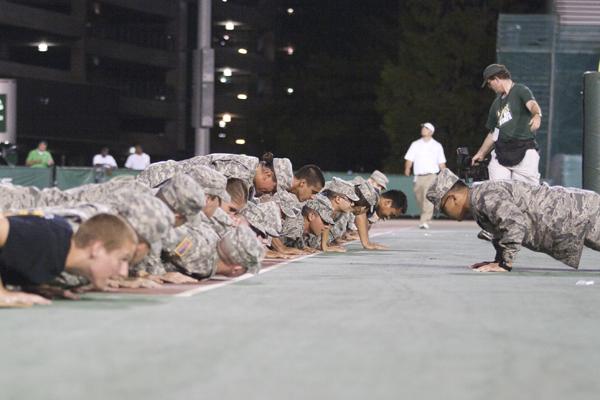 Members of Detachment 88, Sacramento States AIr Force ROTC, perform push-ups after the Hornets scored a touchdown against the Sioux on Saturday in Hornet Stadium.
