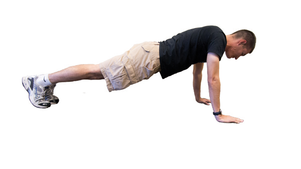 The proper form for a standard pushup is hand shoulder width apart with your back straight.
