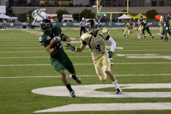 Hornet freshman wide receiver, No. 15, Shane Harrison, scores a touchdown against the Cal Poly Mustangs at Saturday's game at Hornet Stadium. The Hornets won 35-29.
