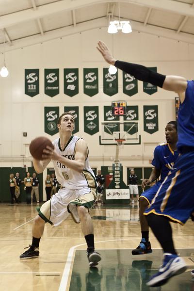 Freshman point guard Dylan Garrity tries to run past his defender during the first half of Saturday nights game against Montana. 