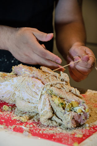 Secure the stuffed turkey breast with twine. Tie it well and remove the twine after the turkey breast is cooked.