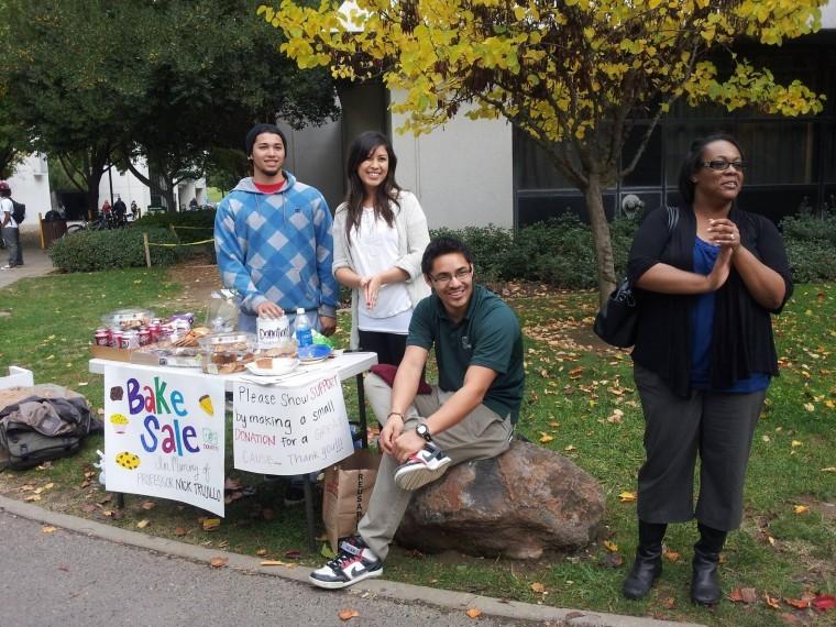 Students from the Small Group Communications class host a bake sale to raise money for the late communication studies professor, Nick Trujillo. From left: Business senior Nick Deis, business junior Ana Aguila, communication studies senior Josh Gonzalez and deaf studies senior Erica West-Oyedele.
