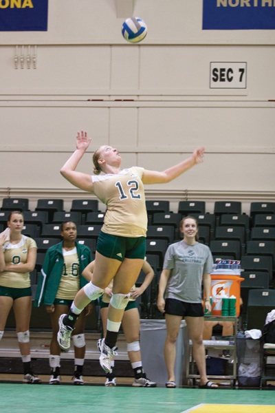 Hornet senior outside hitter Janelle Currey serves the ball in The Nest. 
