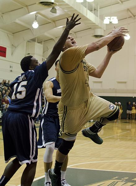Hornets Joey Quigley powers to the basket for a shot during tonights game.
