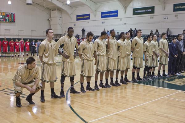 The Hornet basketball team line up before the game against Southern Utah in the Nest wearing their new gold alternate jerseys.
