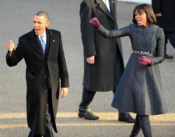 U.S. President Barack Obama and first lady Michelle Obama wave to spectators and supporters on Pennsylvania Ave.near the White House in Washington, D.C., during the Inauguration Parade for Obamas second term, Monday, January 21, 2013. (Chuck Myers/MCT)
