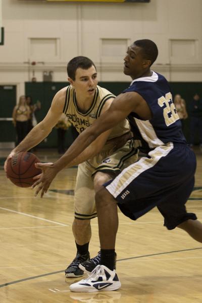 Hornets junior guard No. 1, Jackson Carbajal, plays against Bears sophomore forward No. 22, Tim Huskisson, in the Nest on Saturday.
