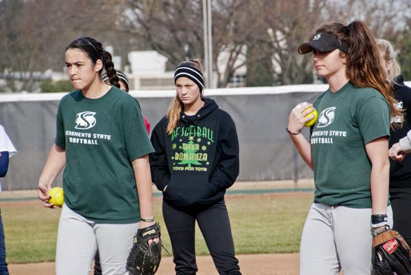 During a softball clinic at Sacramento State’s Shea Stadium, Caitlin Brooks from Escalon California and Taylor Stroud from Santa Rosa California prepare to demonstrate the proper technique of fast pitching on Feb. 2
