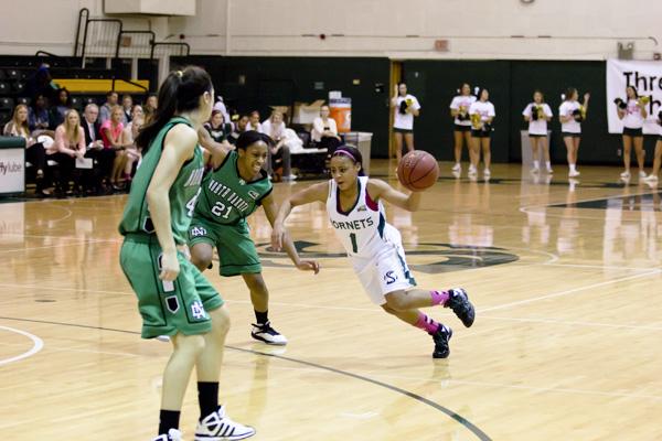 Hornet sophomore guard No. 1 Fantasia Hilliard dribbles down the court against North Dakota on Thursday in the Nest.
