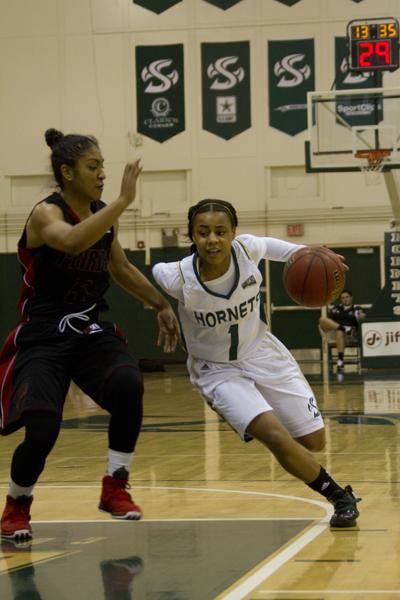 Sophomore guard Fantasia Hilliard dribbles past the defender in her teams 93-86 win against Southern Utah.
