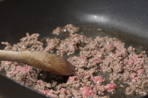 To start off this delicious recipe, brown the meat in a pan and season it with salt and pepper.