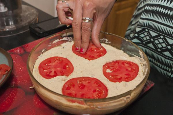 Adding sliced tomatoes on top of the quiche gives it a fresher flavor as it bakes.
