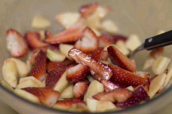 Mix together with sugar, lemon, almond extract, and starch. Then mix in the fruits and gently toss everything together.
