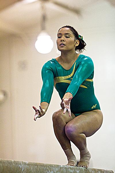 Elideth Guerrero poses to begin her turn on the beam during the meet against the Air Force Falcons on Sunday. Guerrero scored a 9.675 on the beam.
