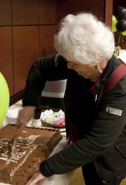 ASI Board Associate, Rita Tyk, cuts the cake during the ASI Election Results party on Wednesday in the Union Redwood room. She will be retiring at the end of the semester after serving Sacramento State for a number of years.
