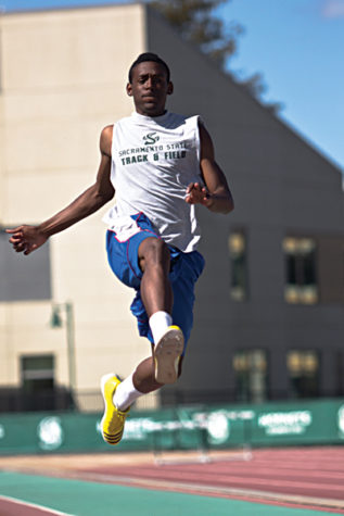 Londeen McCovery performs a long jump during the Hornet’s track and field practice in the Hornet Stadium on April 2.
