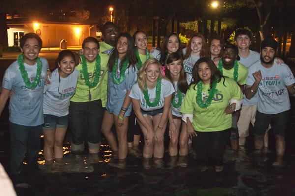 The newly elected ASI board members pose for a group photo in the Library Quads fountain after the ASI Election Results Party on Wednesday.
