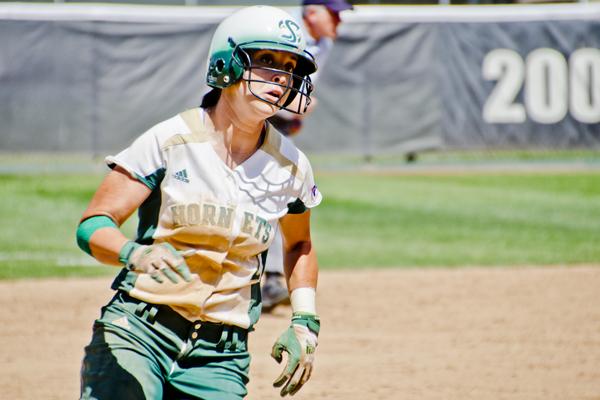 Hornet sophomore outfielder No. 2 Paige Martin runs past third base as she heads for home to score against Idaho State at Shea Stadium.
