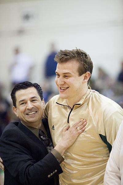 Hornet senior center No. 41 Konner Veteto and head coach Brian Katz embrace during the senior ceremony before the final home game of the season.
