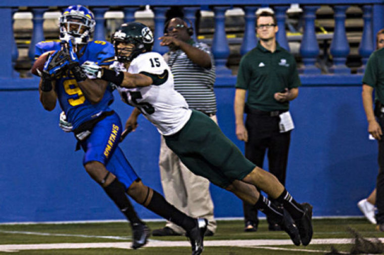 San Jose Spartan Sean Linton, left, intercepts a pass thrown to State Hornet Shane Harrison, right, during their Thursday night game in Spartan Stadium.