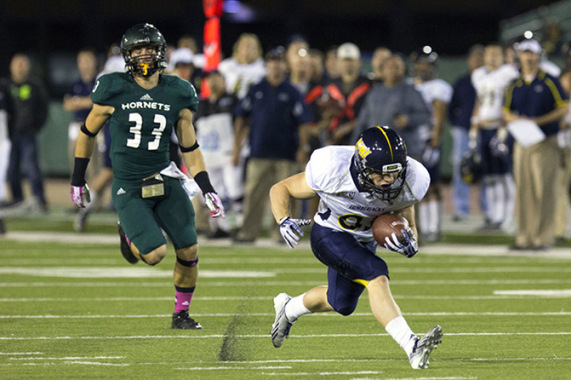 A Northern Arizona Lumberjack gets away from Hornet freshman defensive back No. 33 Nick Crouch at Hornet Stadium on Saturday.