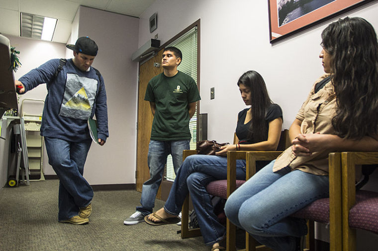 Students (left to right) Trevor Garcia-Neeley, Rodolfo Rodriguez, Victoria Ordorica-Yenez and Denise Fernandez wait outside Friday’s Student Fee Advisory Committee closed meeting in Lassen Hall.
