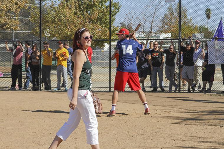 Grandslam chair and Criminal Justice senior Erys Melendez walks across the field as different fraternities and sororities compete in a home run derby.