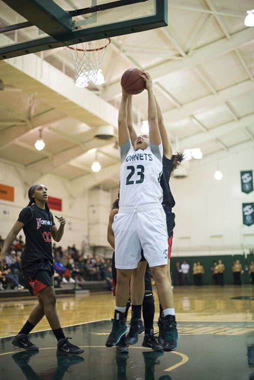 Freshman forward No. 23 Hallie Gennett shoots the ball against the Cal State Northridge Matadors.