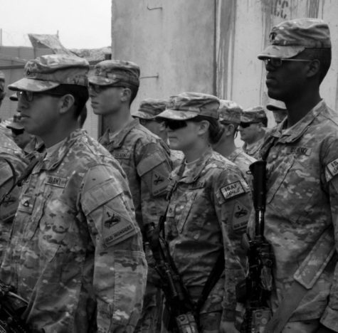 Army Private First Class Rosie Darby stands in a formation at a combat outpost in the Zhari district of Kandahar province, Afghanistan on February 1, 2013. (Alexandra Zavis/Los Angeles Times/MCT)