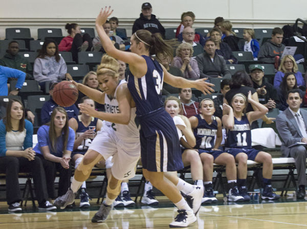 Junior forward Shanti Smith pushes through the Bobcats defense in the 107-95 win at The Nest. 