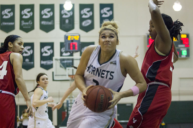 Junior forward Shanti Smith goes up for a lay-up during a game in The Nest.