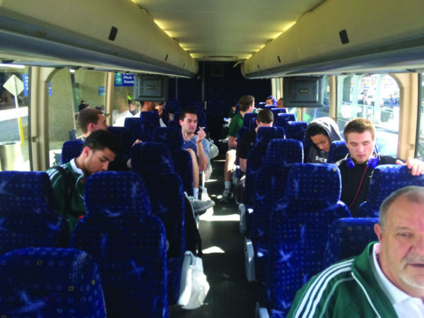 Hornet basketball players prepare for a bus ride to Ogden, Utah. 