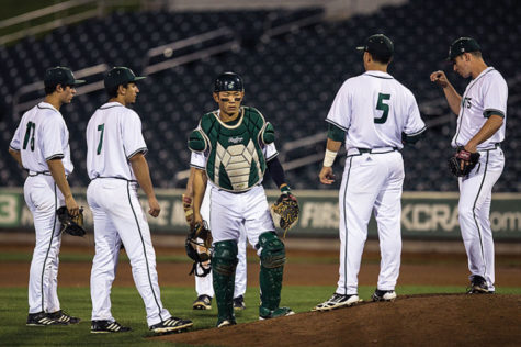 Members of the Hornet baseball team visit the mound midway through their match against University of Nevada on Feb. 25 at Raley Field.