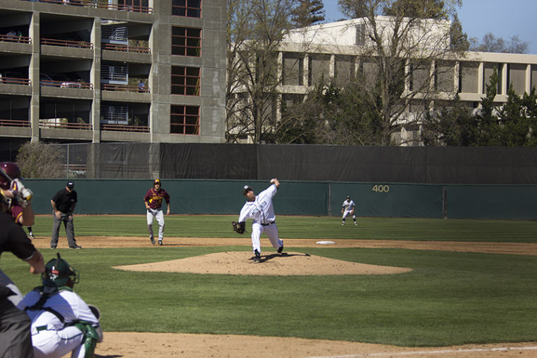 Starting pitcher Sam Long delivers the pitch to a University of Minnesota batter, Saturday at John Smith Field.