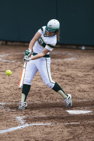 Hornet Sasha Margulies hits the ball to center field into the glove of the Aggie's defense.