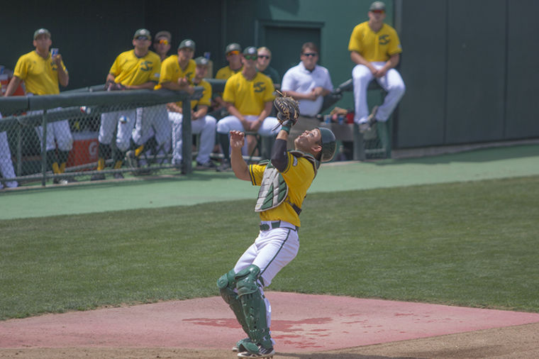 Catcher Dane Fujinaka tracks down the foul ball for an out in the top of the fourth inning.