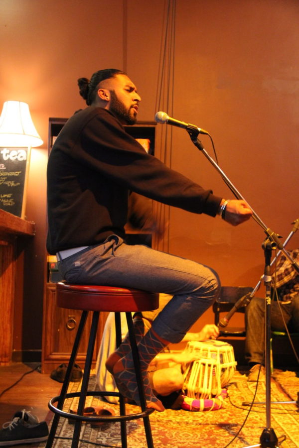 Salvin Chalal performs using clever wordplay on July 25, at the Heartwood Community Cafe in Vancouver, Canada. 