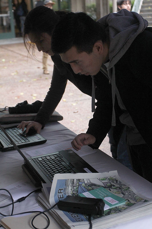 Freshman bussiness major Bikyt Djaparou votes at a voting center outside the Union Wednesday Dec. 3 after class.