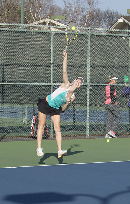 Sophomore Tori Trylovich serves a ball during the season opener against the University of San Francisco on Jan. 21, 2015, where the Hornets went on to lose 5-2. Trylovich picked up her first career win in her debut match.