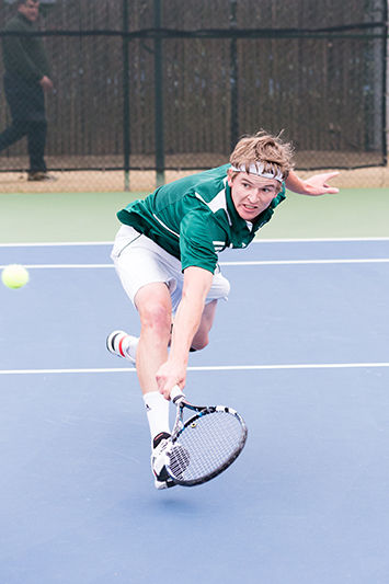 Sac State senior Tom Miller sprints towards the left corner of the court to backhand a ball during his singles match against Pacific on Saturday, Feb. 21, 2015. Miller lost his match against Pacific freshman Bernardo Oliveira.