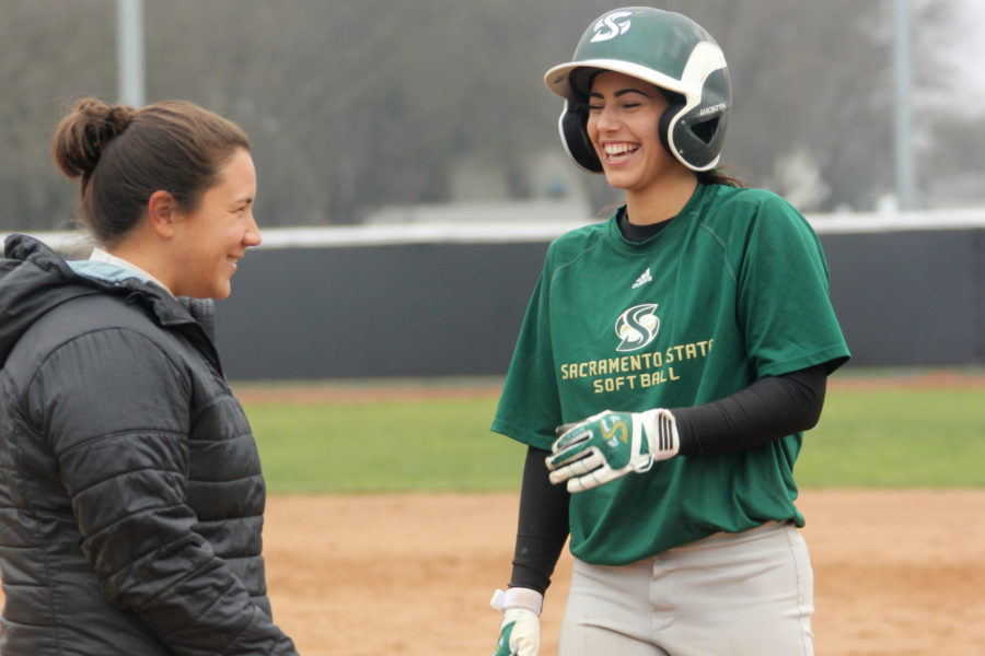 Senior+Paris+Prado+jokes+with+coach+Danielle+Kaminaka+while+running+bases+during+a+practice+on+Thursday+Jan.+22%2C+2015.+Prado+was+granted+another+year+of+eligibility+after+she+was+cut+from+the+softball+team+her+freshman+year.