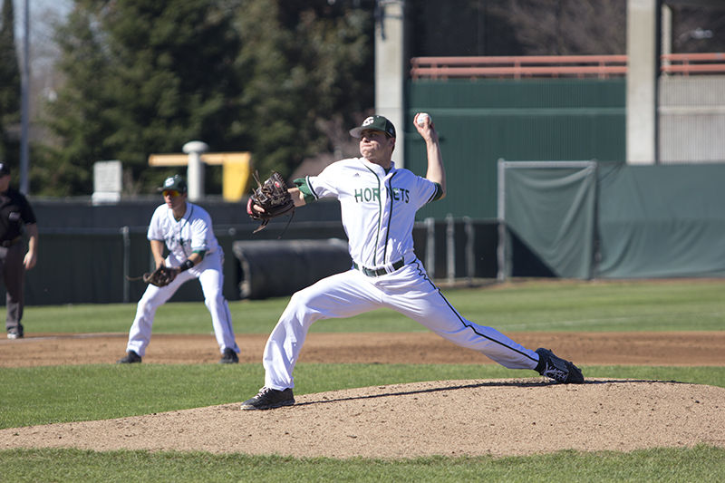 Sacramento State baseball's sophomore pitcher Sam Long made the start in Saturday's game against Utah on Feb. 14, 2015 at John Smith Field. Long threw an impressive outing totaling five innings with no earned runs. Third baseman Brandon Hunley sits in ready position.