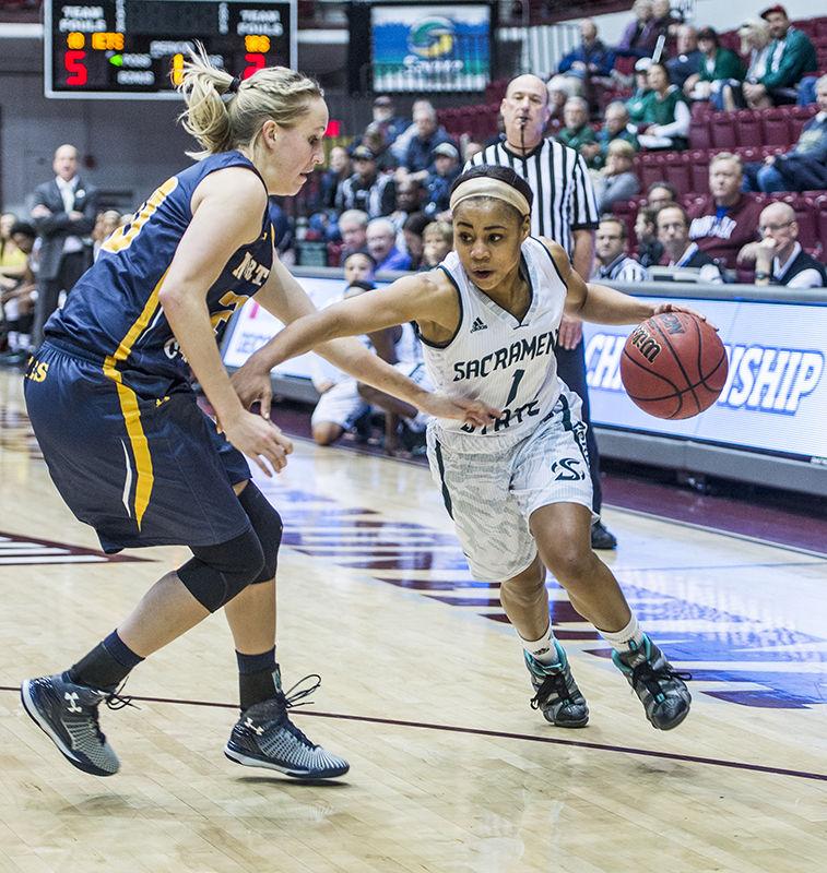 Senior Fantasia Hilliard pushes past an University of Northern Colorado player as she heads to the basket in the semifinal of the Big Sky Conference Tournament on March 13, 2015 in Missoula, Montana. The Hornets went on to lose the game 81-79 in overtime.