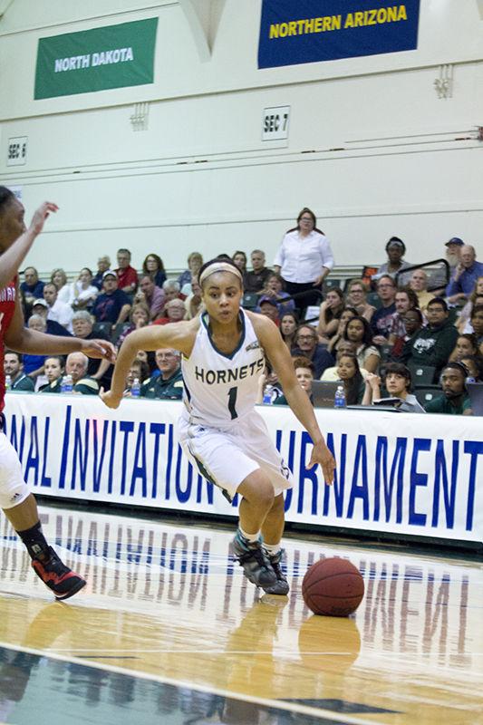 Senior Fantasia Hilliard dribbles past a Saint Marys defender on Thursday, March 26, 2015 at the Hornets Nest. The Hornets were defeated 77-69.