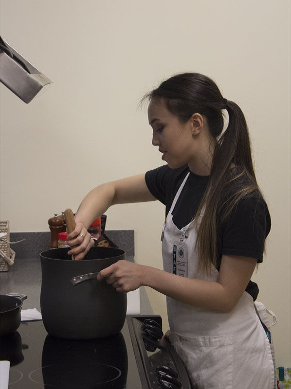 The Sac State Health & Counseling holds a cooking demo in the Cove located in the Well on Tuesday, Feb. 24, 2015. The chefs prepared a simple and healthy meal for the audience.