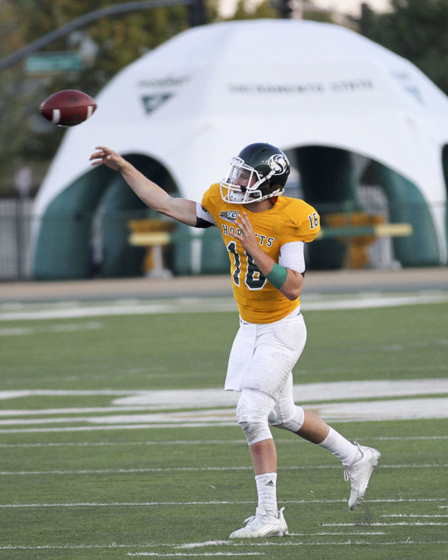 Quaterback Daniel Kniffen drops back to pass the ball to a receiver on Saturday, Sept. 5, 2015 against Eastern Oregon. Kniffen was 22-for-34 with 282 yards and two touchdowns on the night leading the Hornets to a 41-20 victory over the Mountaineers.