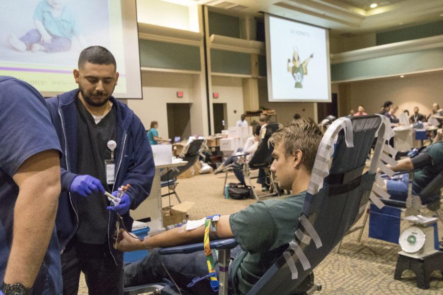 Eric Muller, sophomore, has blood sample taken at the University Union, Oct. 20, 2015.